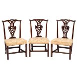 A set of six George III and later carved mahogany dining chairs in the Chippendale taste:,