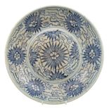 A Korean blue and white dish: painted with stylised flowers and foliage, 23.