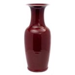 A large Chinese flambe baluster vase: covered overall in a mottled ox-blood and lavender glaze,