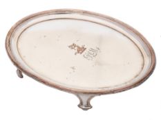 A 19th century Sheffield plate teapot stand: crested and initialled,