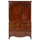An early 19th Century mahogany linen press:, the upper part with a moulded cornice,