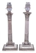 A pair of Edward VII silver Corinthian column candlesticks, maker Thomas A Scott, Sheffield,