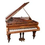 A late 19th Century rosewood cased grand piano by Bechstein,: with fret carved music stand,