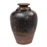 A large Vietnamese stoneware storage jar: of oviform with raised flaring neck,