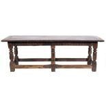 A 17th Century and later oak refectory table:, with an overhanging plank top,
