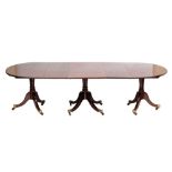 A Regency and later mahogany D-end triple pillar dining table:, the top with a reeded edge,