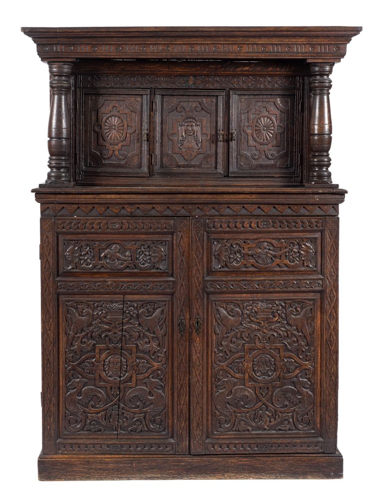 A carved oak court cupboard:,