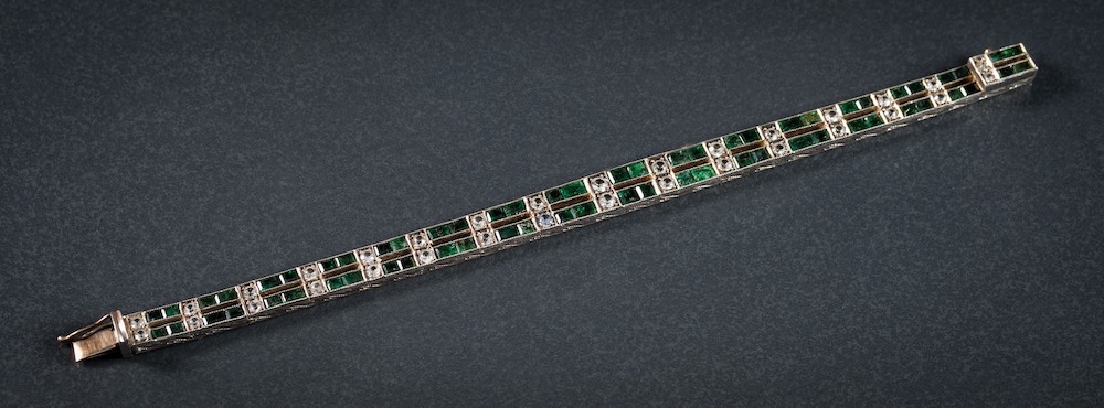 An Art Deco-style emerald and white gem-set bracelet: set with rectangular emeralds and circular