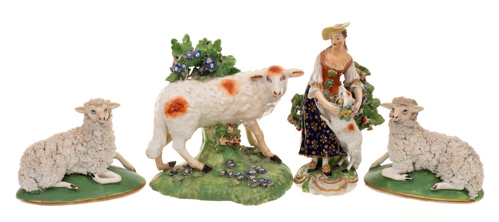 A pair of 19th century English porcelain models of sheep,