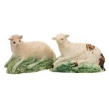 Two Staffordshire models of reclining sheep: decorated in green and brown glazes, circa 1800,