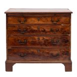 A George III mahogany rectangular chest:, the top with a moulded edge,