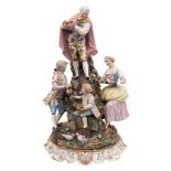 A late 19th century Dresden porcelain 'Musical' group: in the form of a standing gallant playing