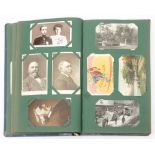 An Edwardian postcard album and contents: mainly GB topographical and portrait cards,