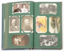 An Edwardian postcard album and contents: mainly GB topographical and portrait cards,