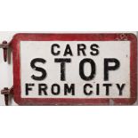 A cast aluminum double sided tram sign 'Cars Stop From City': black and white with red border and