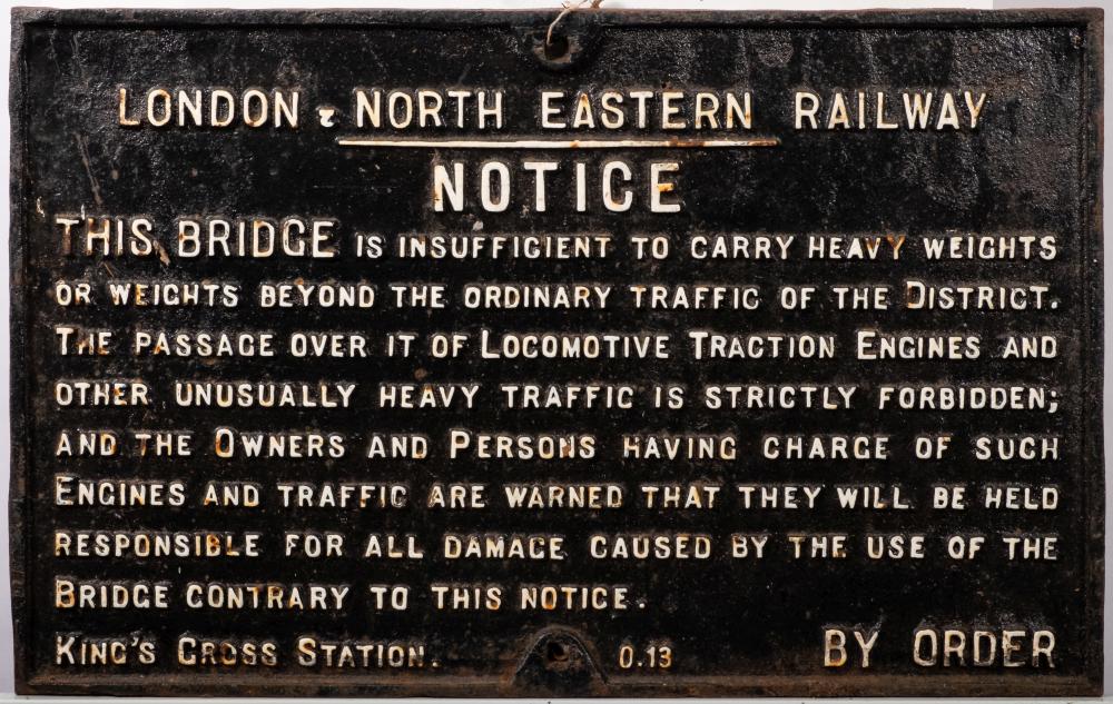A LNER cast iron bridge weight restriction notice: raised text, marked 'King's Cross Station 0.
