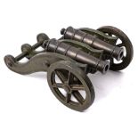 A late 19th century bronze double cannon: the two 6 1/4 inch five stage barrels with plain cascabel,