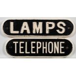 Two cast iron doorplates 'Lamps and 'Telephone': 8 x 21cm and 9 x 29cm respectively.