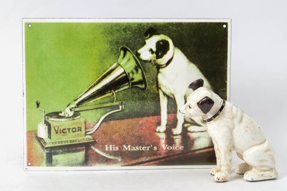 A reproduction enamel 'HMV' advertising sign: 24 x 32cm together with an aged cast iron figure of