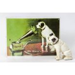A reproduction enamel 'HMV' advertising sign: 24 x 32cm together with an aged cast iron figure of