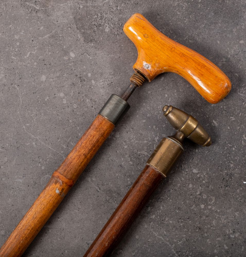 A late 19th/early 20th century customs stick with wooden handle and bamboo shaft enclosing a steel