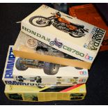 A collection of various empty Tamiya model kit boxes: containing modelling parts etc.