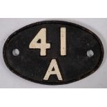 An Eastern region cast iron oval shed plate '41A': 19cm wide.
