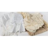 A quantity of various textiles including a white cotton bonnet and a christening gown: (a lot).