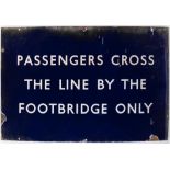 A BR(E) enamel station sign 'Passengers Cross The Line By The Footbridge Only': 61 x 91cm (damaged)