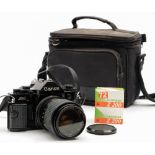 A Canon A-1 35mm SLR camera: fitted Unitor 35-70mm lens, together with a Sunpak Auto 28SR flash,