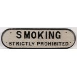 A cast iron doorplate 'Smoking Strictly Prohibited': 15 x 54.5cm.