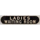 A cast iron doorplate 'Ladies waiting Room': double line 12 x 53cm.