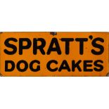 An enamel sign 'Spratt's Dog Cakes:' black text on an orange ground, 30 x 76cm.