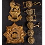 A Victorian brass Royal Marines valise badge: together with a Devon Light Infantry helmet plate and