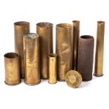 A WWI cast iron shell case, together with a group of WWI & WWII brass shell cases.