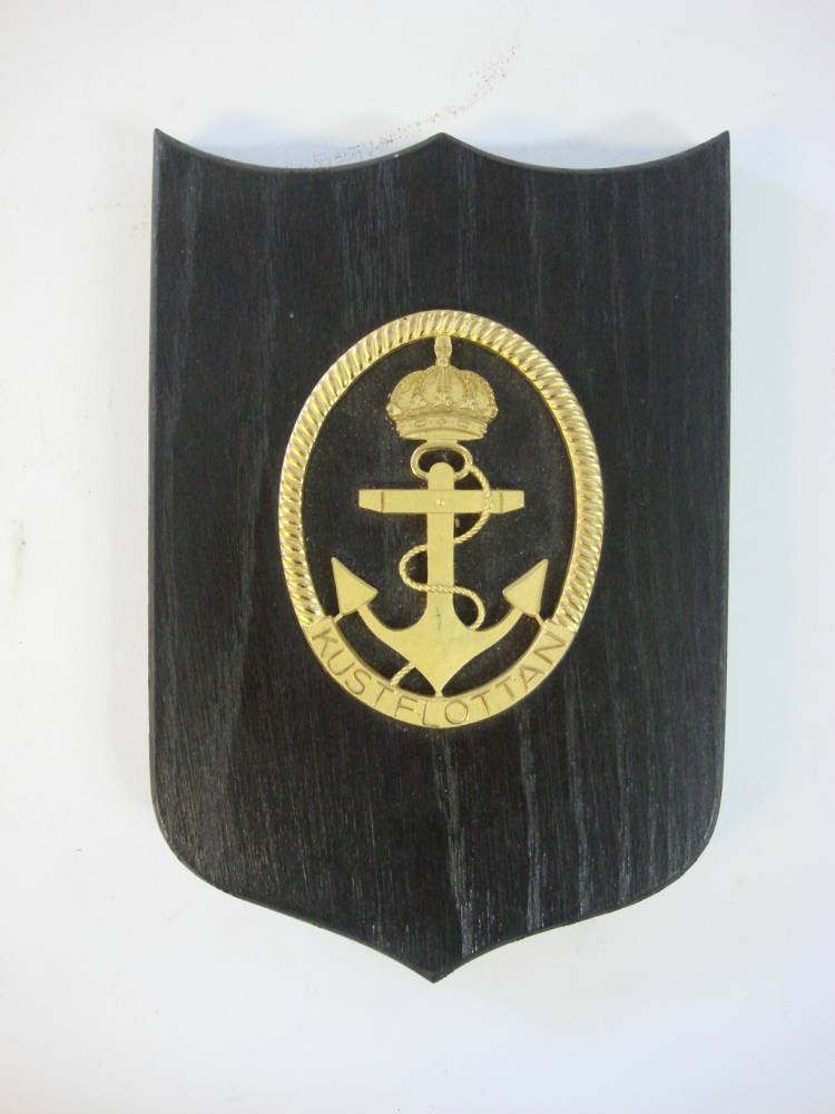 A Scandinavian ward room badge for the Kustflottan (Coastal Fleet): gilt on ebony plinth, 19cm high.