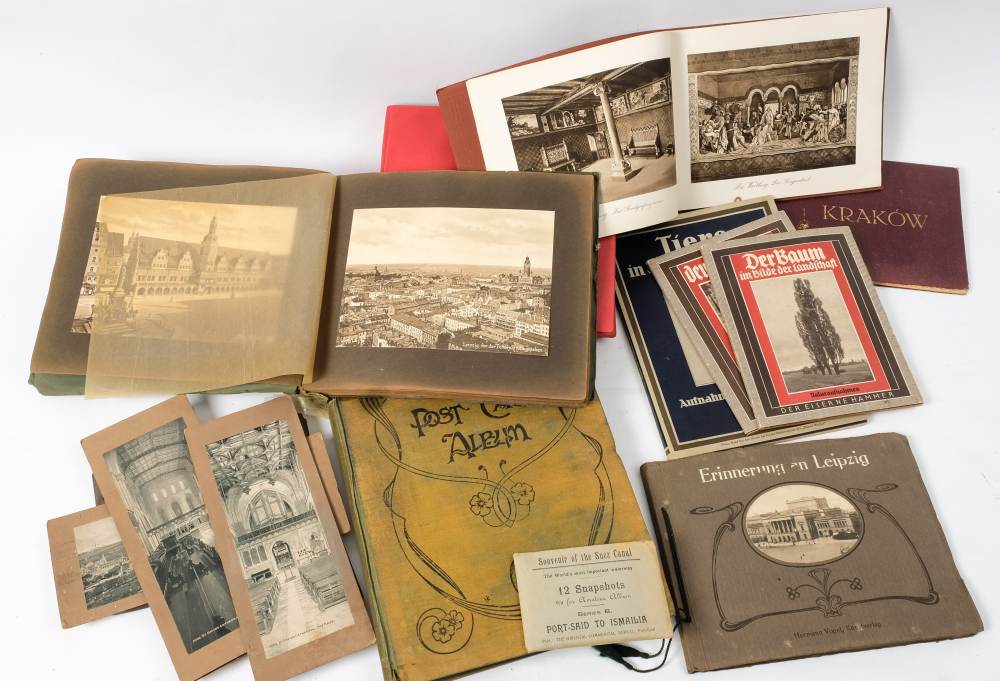 An early 20th century postcard album and contents: including a number of cards of an athletic event,