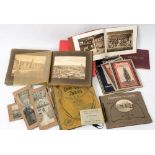 An early 20th century postcard album and contents: including a number of cards of an athletic event,
