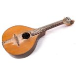 An early 20th century Portuguese guitarra: with scroll carved headstock , rosewood fretboard,