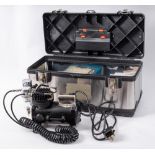 An Iwata Studio Series Sprint Jet compressor with airbrush and accessories in rigid case:.