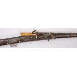 An early 19th century Indian Matchlock musket (Turador): the 39 inch barrel decorated to muzzle and