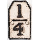 A cast iron quarter mile marker sign: raised numbers with border in a hexagonal,