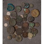 A mixed group of coins including Roman: and a Faience 'Eye of Horus' charm.