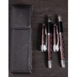 A Cross pen set: comprising fountain pen and biro with dark metallic coloured body with geometric