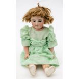 A late 19th/early 20th century bisque head doll by J Steiner-J Bourgoin: applied blonde wig over