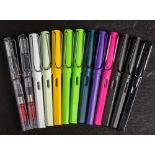 A group of 13 Lamy (Germany) fountain pens in various colours.