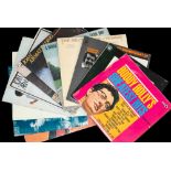 A group of thirteen vinyl albums by singers, songwriters, etc.