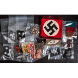 A collection of military cloth insignia, mostly German: including a NSDAP armband,