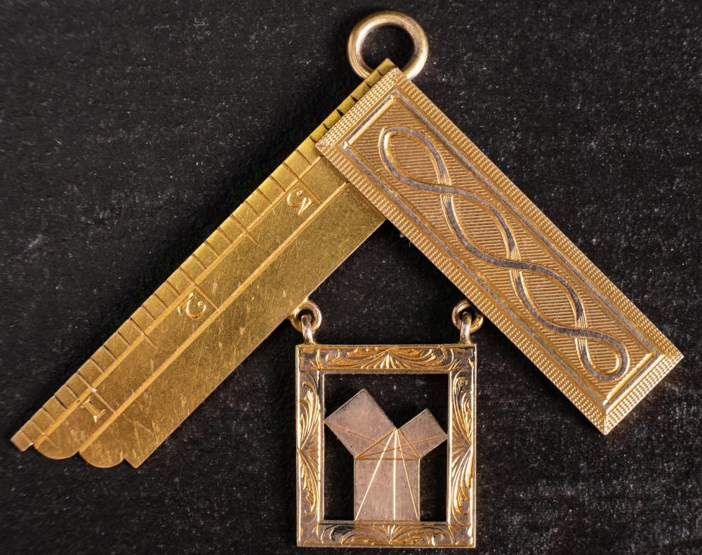 A yellow metal Masonic suspension for 'The Eddystone Lodge,