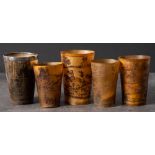 A group of five 19th century horn hunting cups: all with incised decoration,